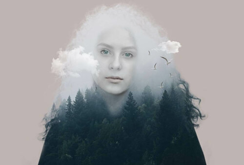 A woman between a forest and clouds.