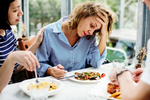 A woman feeling concerned about eating.
