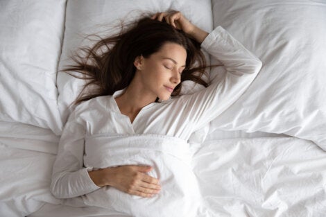 A woman sleeping soundly in bed.