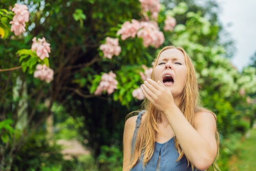 A woman sneezing.