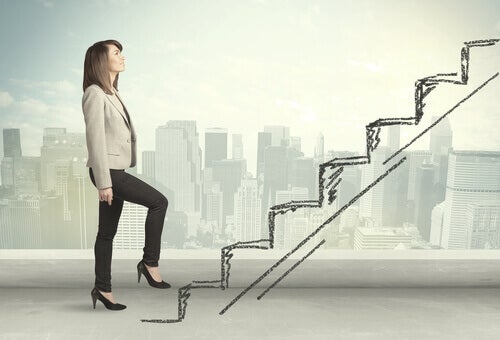 A woman going up stairs.