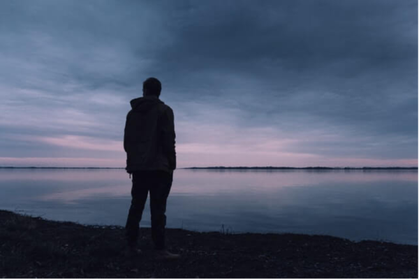 A man standing on a beach.