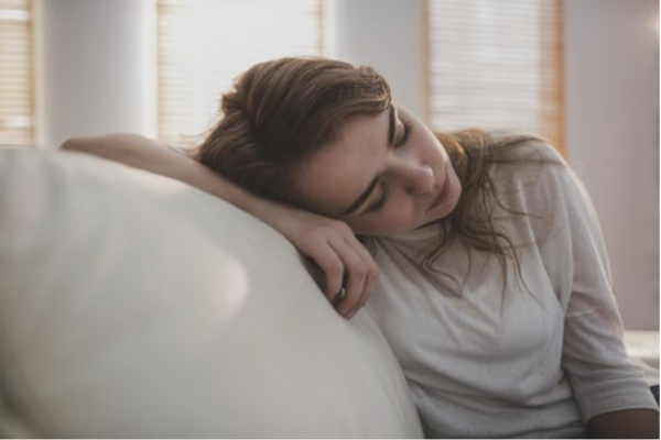 A woman looking depressed.
