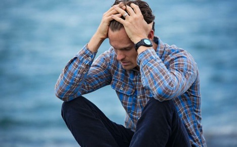 A man looking stressed.