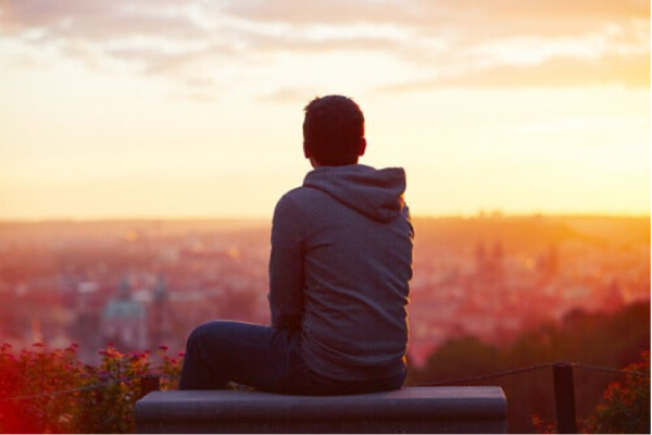A man looking out over a city.