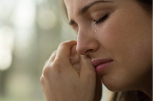 A woman crying.