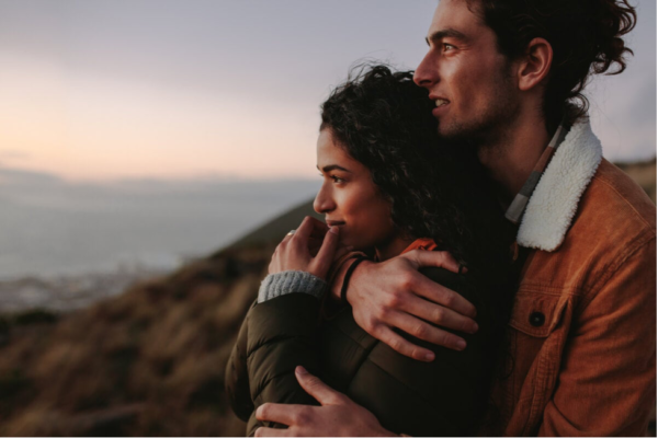 A happy couple, demonstrating loving is giving something you don't have.
