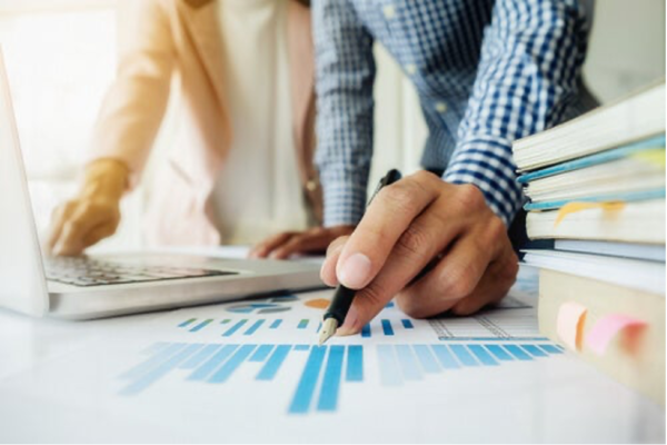 Someone filling in a chart.