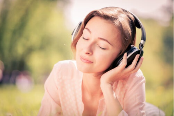 A woman wearing headphones.
