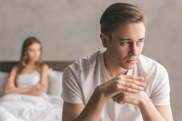 Two people in bed.