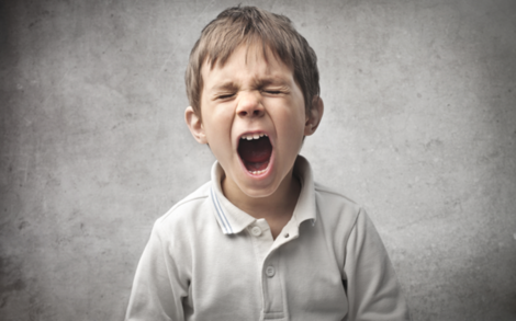 A little boy yelling.