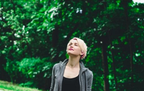 A woman walking in the forest.