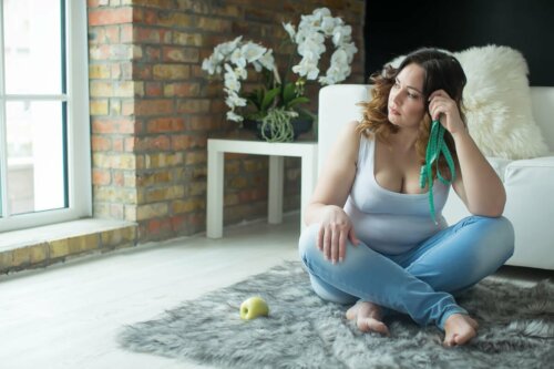 A woman feeling frustrated while working out.