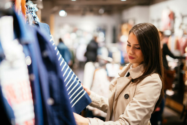 A woman looking at clothes.