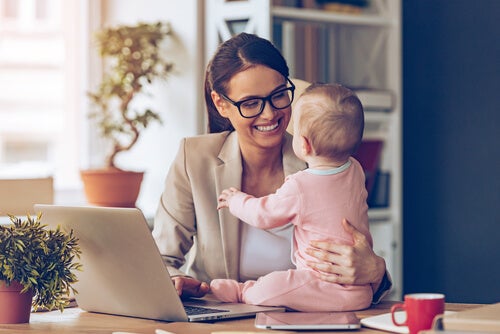 A woman holding a baby.