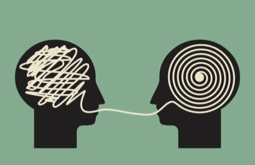 Two heads communicating.