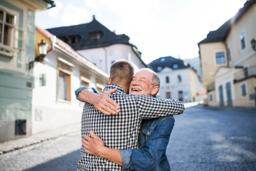 A father hugging his son.