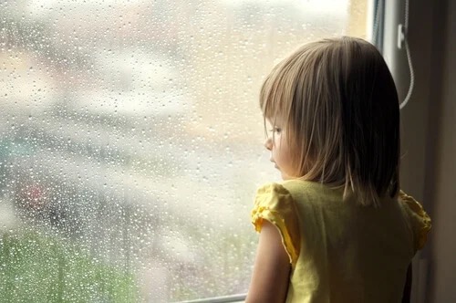 A child looking out of the window.