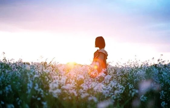 A woman in a field.