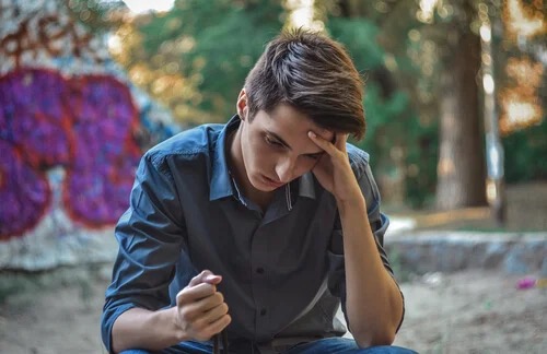 A teenager looking angry.