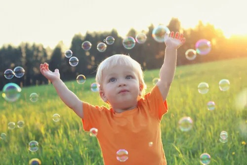 A child and some bubbles.