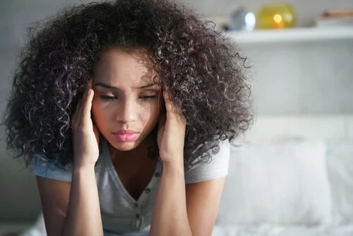 A woman looking depressed.