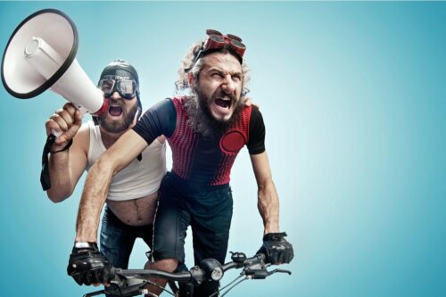 Two men riding a bike.