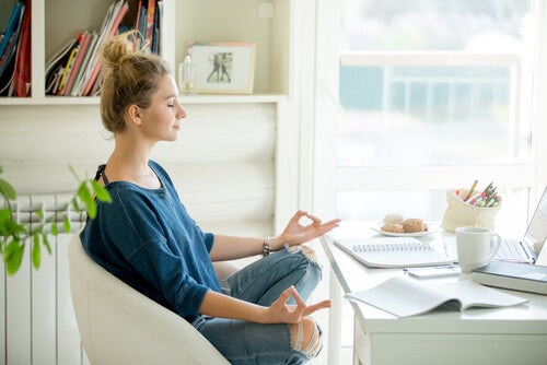 A woman meditating.
