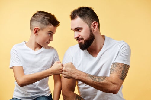 A boy and a man sporting the same unlovely haircut.