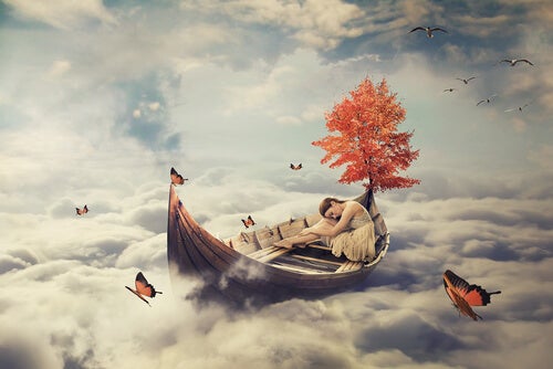 Tjej som sover i en båt och överväger betydelsen av drömmar.