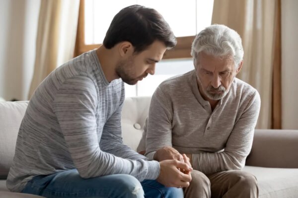A father and son depicting codependency in the family of an addict.