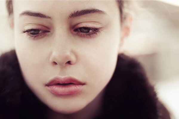 A woman looking sad.