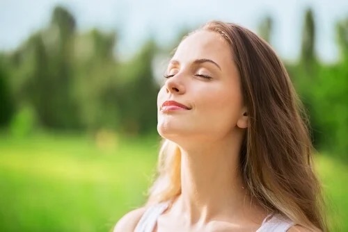 A woman looking relaxed.