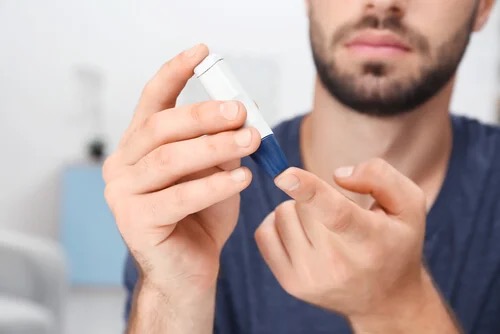 A man testing his blood.