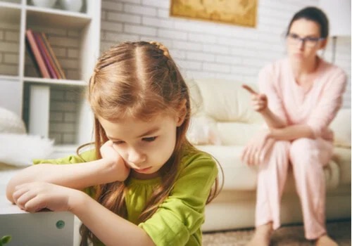 A child being told off.