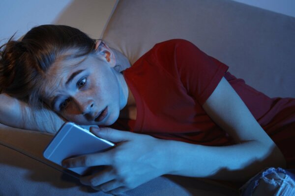 A girl looking at her phone.