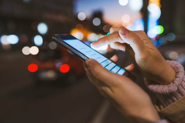 A person looking at their cell phone.
