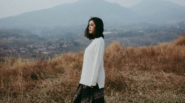 A woman in a field.