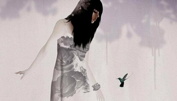 A woman looking at a bird.