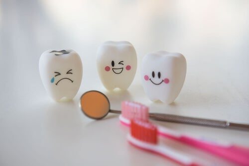 Three teeth and a couple toothbrushes.