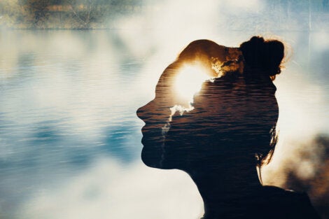 A woman's face superimposed over water representing the ego.