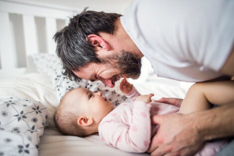 A father talking to his baby.