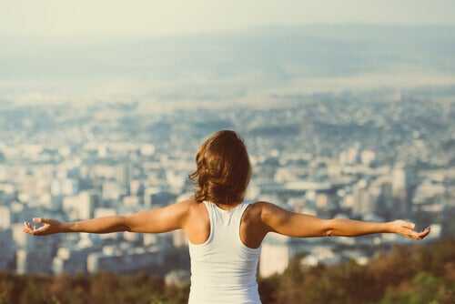 A woman feeling motivated after reading Goethe's most powerful quotes.