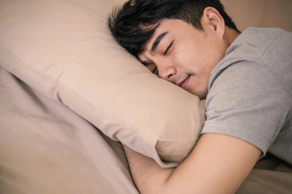 A young man sleeping.