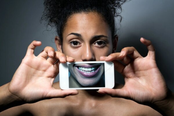A woman framing her smile.