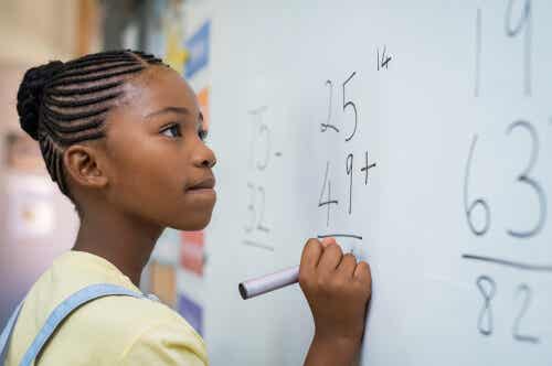 A girl working on a math problem.