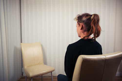A person talking to a chair.