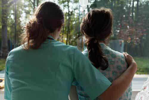 Two people hugging.