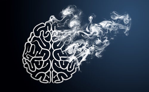 Outline of a brain with smoke coming out showingn what lies behind laziness