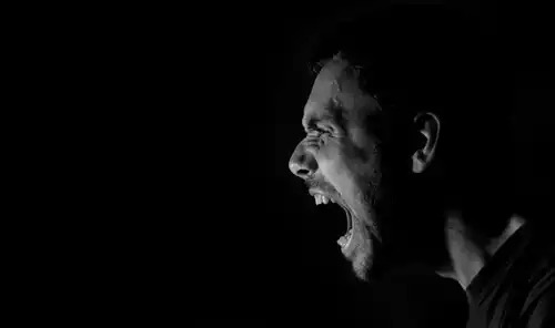 A man screaming.